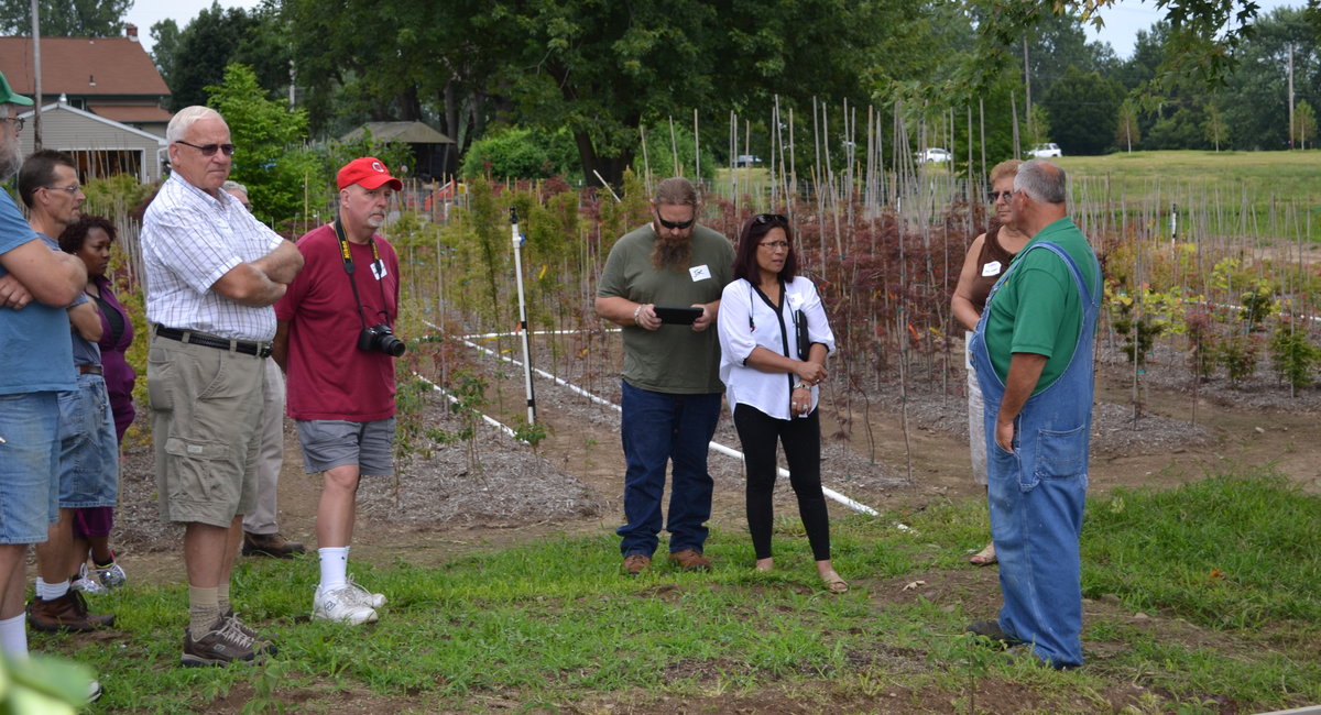 Backyard growers discuss growing practices.