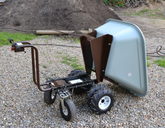 This electric wheelbarrow hauls heavy loads and dumps with ease.