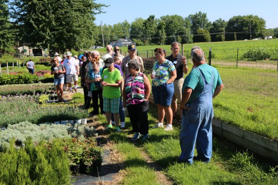 A group of plant lovers touring Mike's Plant Farm.