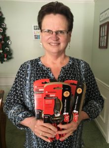 Pam McGroarty, showing off pruning shears.